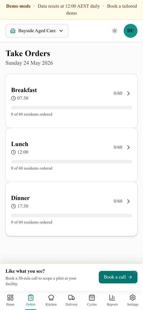 PCA taking lunch orders on a phone — resident list with dietary tags